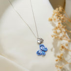 Close view of periwinkle beaded butterfly with pearly heart and crystal butterfly accent