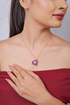 Fuchsia beaded knot pendant with a pearly centre on a rose-gold-tone bead-station chain