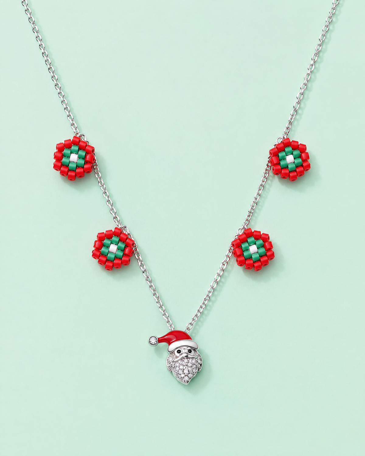 Santa Charm Necklace on mint background