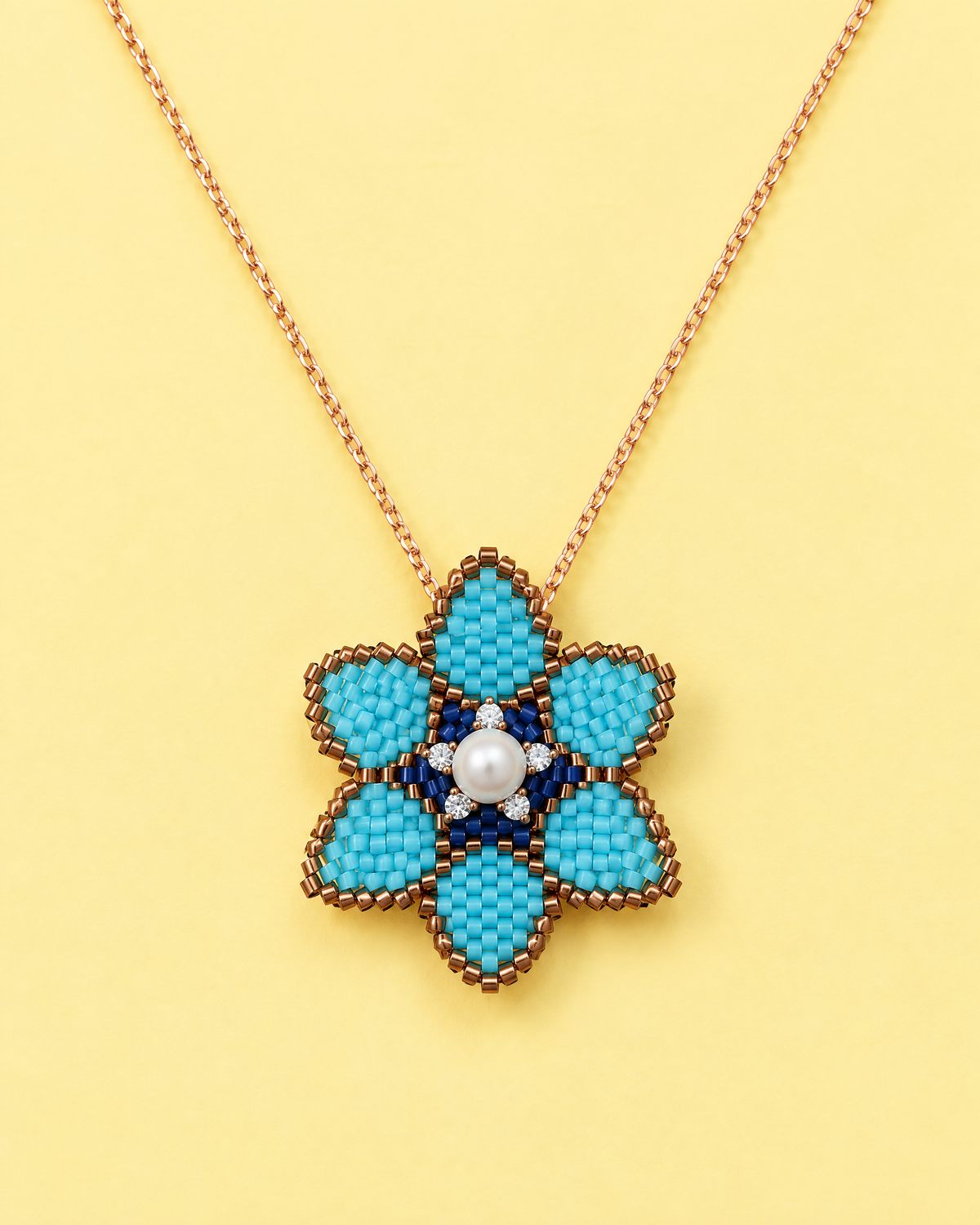 Turquoise Blossom Pendant on yellow background