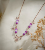 Magenta, lilac and white bead tubes with crystal butterfly charms on cream silk