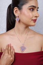 Model wearing pastel beaded kite pendant on silver chain with matching kite drop earrings