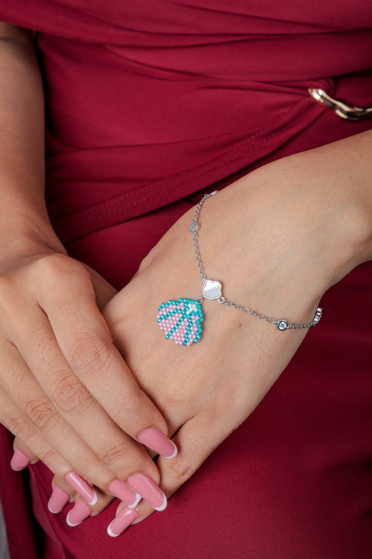 Silver chain bracelet with pink and turquoise beaded seashell charm and pearly clover link